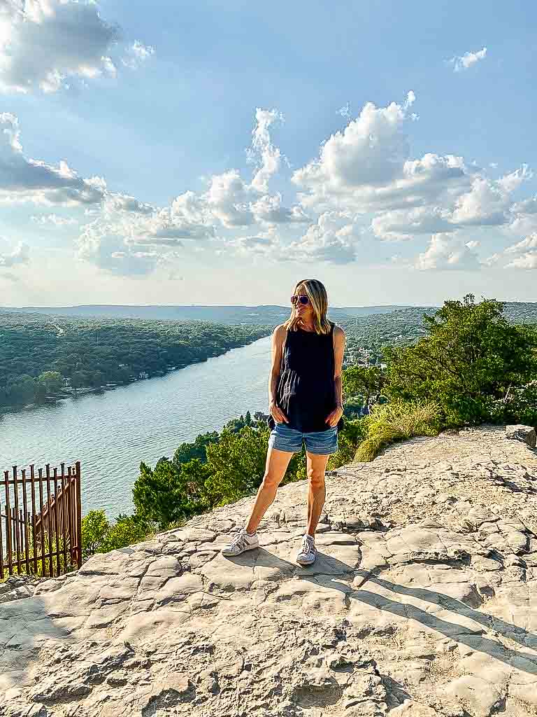 girl standing at mount Bonnell