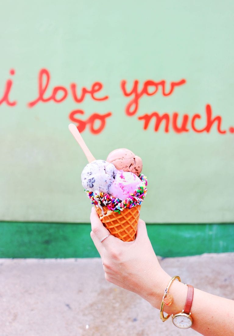 3 scoops of Amy's Ice Cream in front of I Love You So Much mural